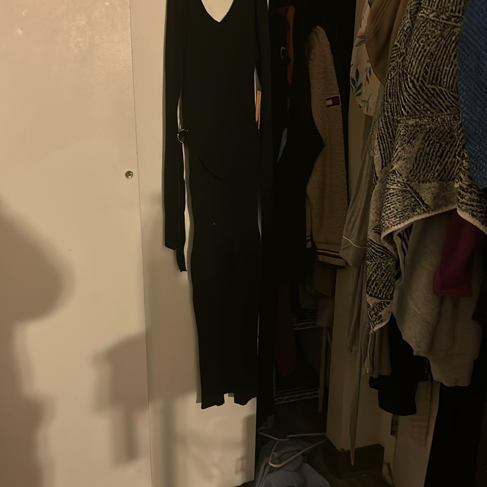 Long sleeve bodycon black dress with belt. Length to ankles. Size L